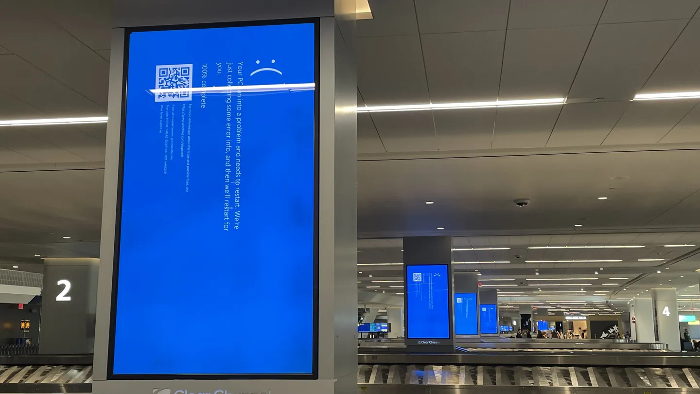 Blue crash screens on the airport display boards at LaGuardia Airport during the July 2024 outage