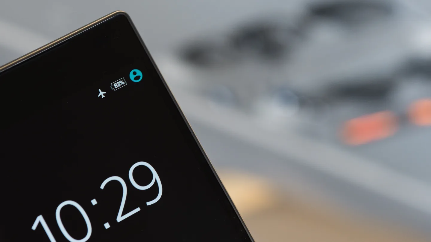 A smartphone lock screen showing the time
